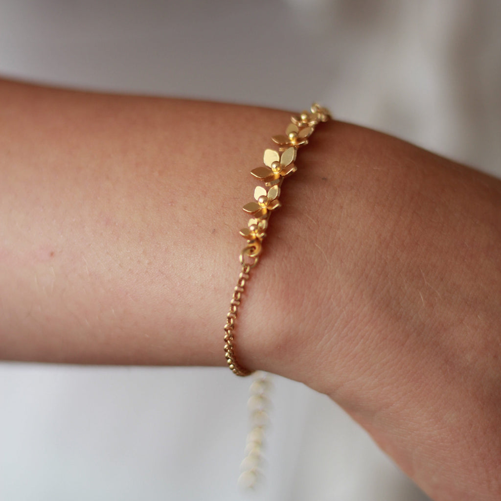 Dicca Pulsera 5 dijes mini guayacán